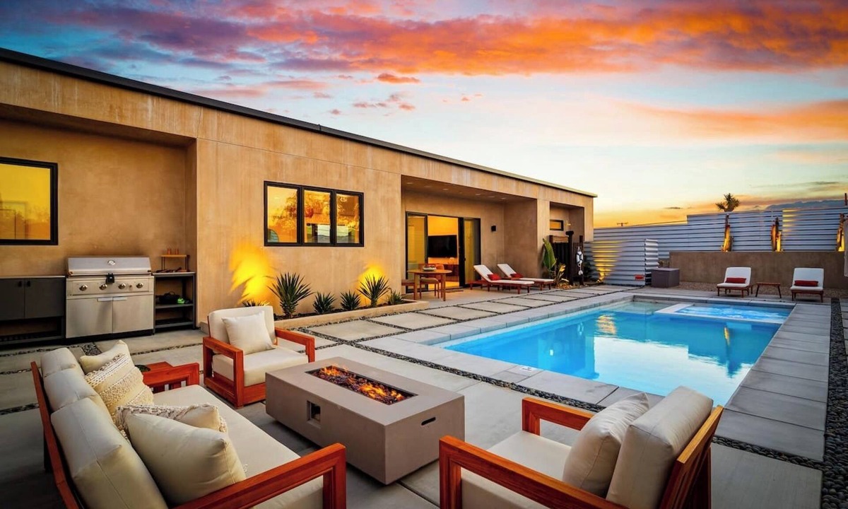 Yucca Valley House | A serene luxury desert retreat near Joshua Tree National Park with panoramic mountain views, a private pool and spa, an open-air rain shower sanctuary, and an expansive stargazing patio in the Mojave Desert.