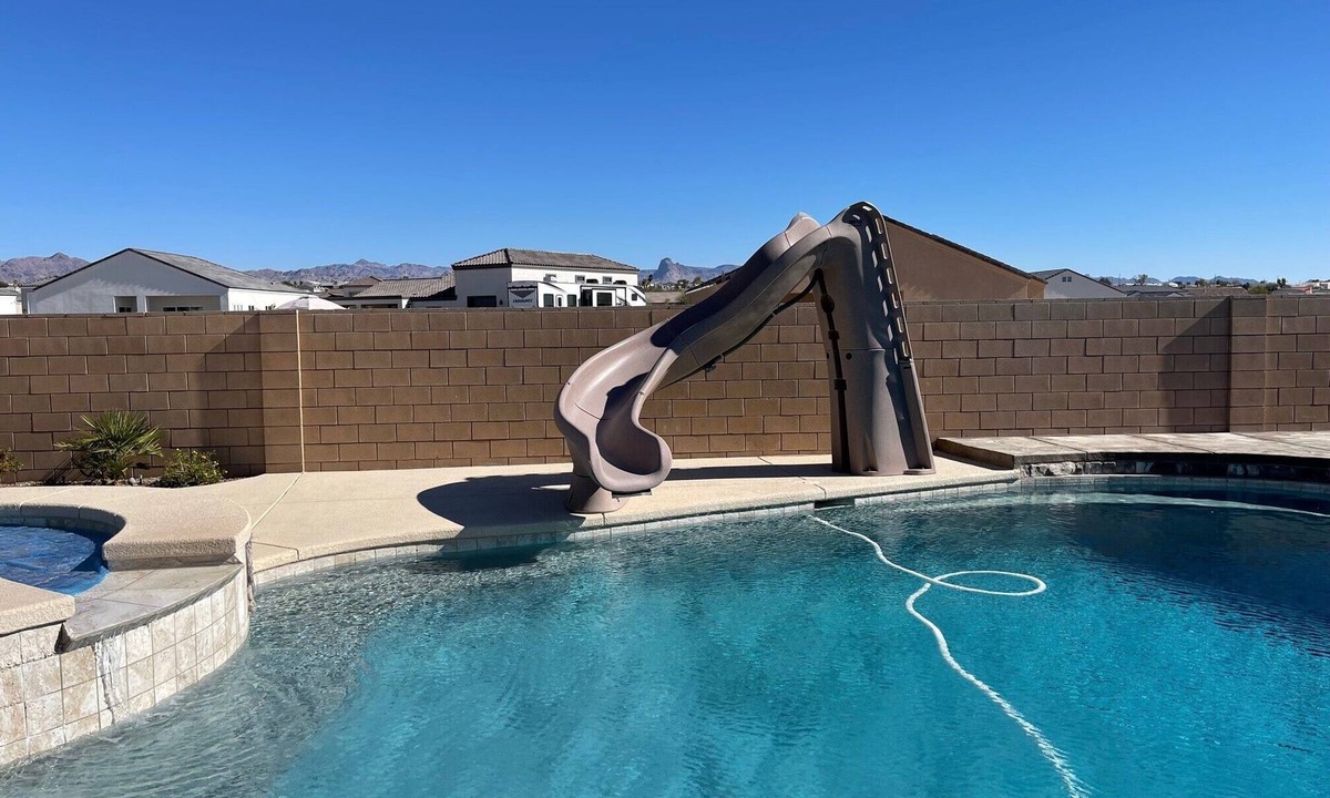Fort Mohave House | Colorado River Getaway, Resort Pool, Waterslide & Mountain Views
