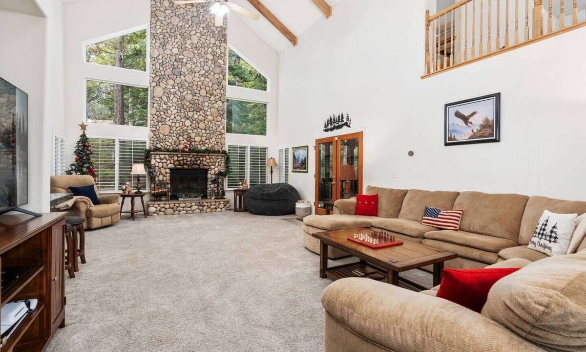 Shaver Lake House | Family-friendly mountain retreat with two game rooms, a screened-in patio with firepit, garage game zone, hot tub, sauna, yoga mats, and beautiful Sierra views.