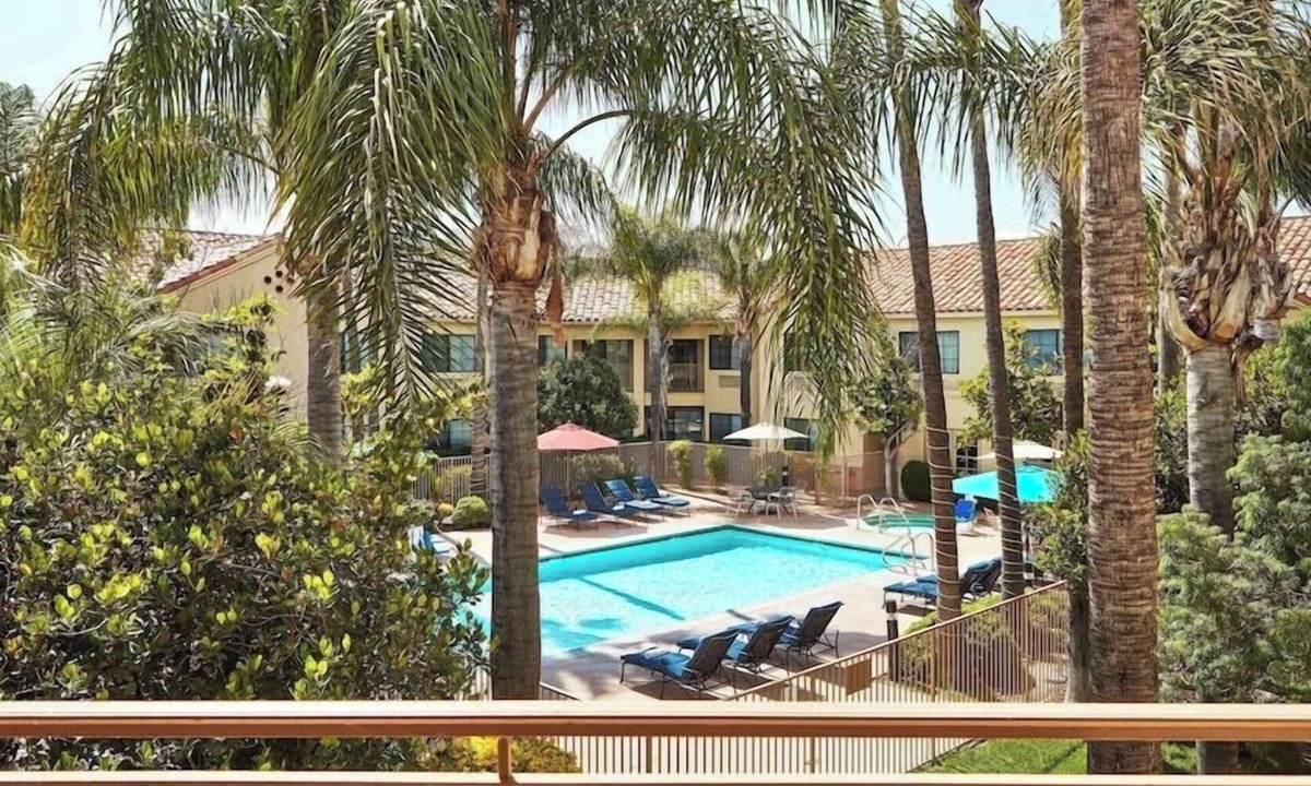 Valencia Hotel | Grand Balcony King Room | Overlooking Pool & Courtyard | On-Site Dining