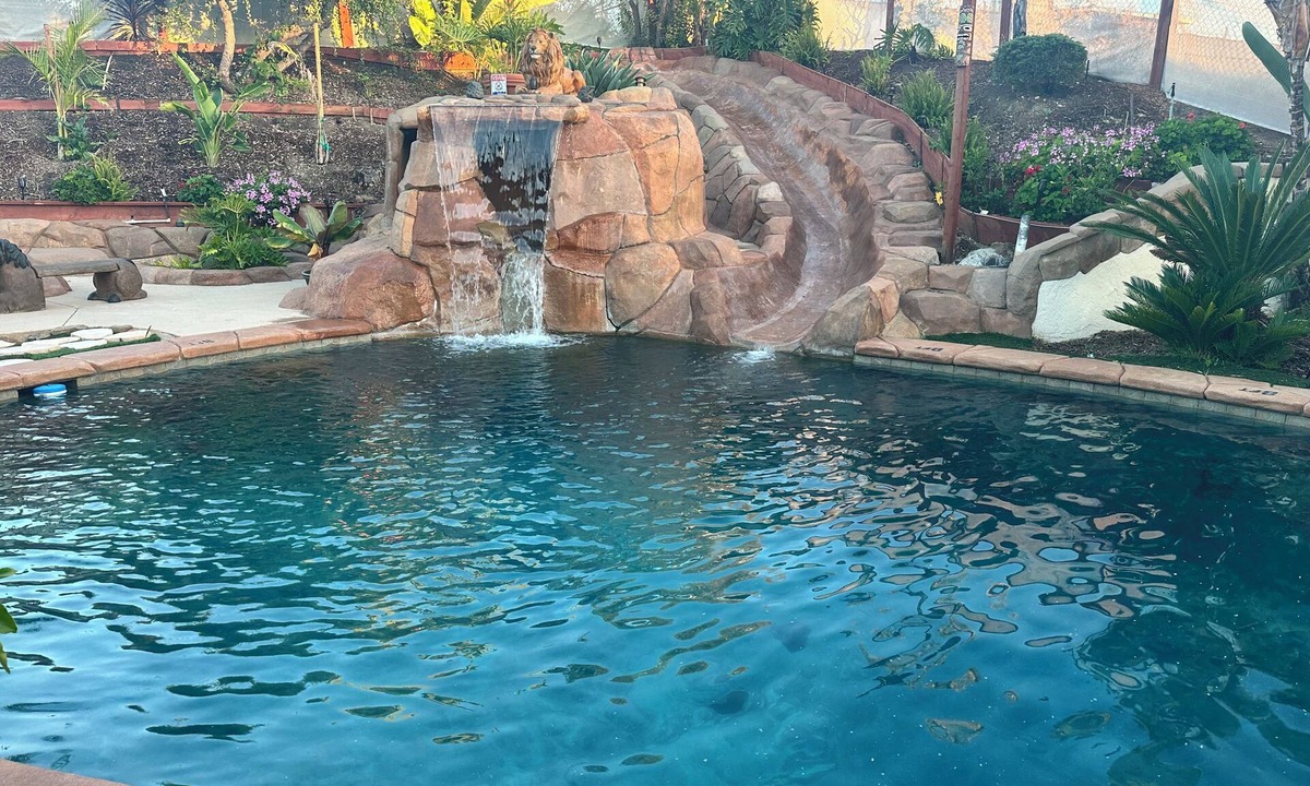 Oak Park House | Private oasis in backyard, beach entry solar heated pool, jacuzzi & water slide