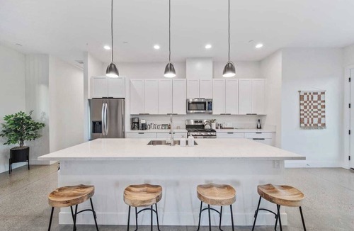Yucca Valley House | A serene luxury desert retreat near Joshua Tree National Park with panoramic mountain views, a private pool and spa, an open-air rain shower sanctuary, and an expansive stargazing patio in the Mojave Desert.