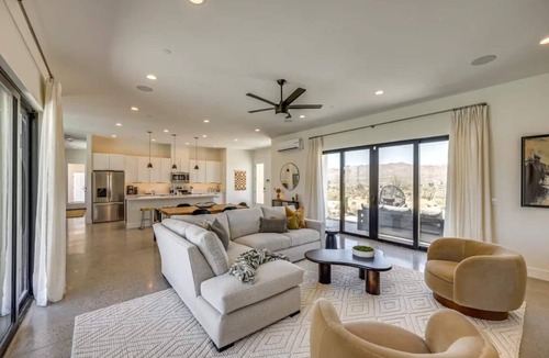 Yucca Valley House | A serene luxury desert retreat near Joshua Tree National Park with panoramic mountain views, a private pool and spa, an open-air rain shower sanctuary, and an expansive stargazing patio in the Mojave Desert.