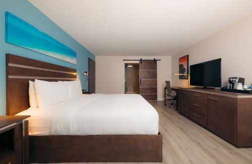 Harbor Hotel | Cove Hotel, King Suite | Relax by the Pool, Sip at the Bar, Stroll Downtown