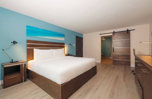 Harbor Hotel | Cove Hotel, King Suite | Relax by the Pool, Sip at the Bar, Stroll Downtown