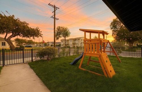 Lawndale House | Cozy Playhouse Retreat with Private Yard & Theater Lounge