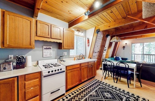 Crestline House | Dog-friendly 2-story home with large deck, tree views, fireplace, & W/D