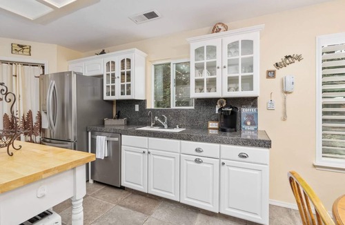 Shaver Lake House | Family-friendly mountain retreat with two game rooms, a screened-in patio with firepit, garage game zone, hot tub, sauna, yoga mats, and beautiful Sierra views.