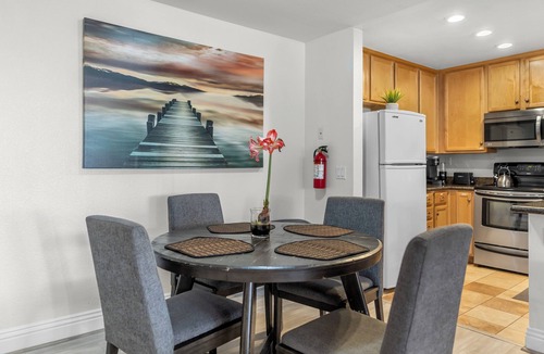 Corona Apartment | First floor 1BR condo with patio, king bed, pool and gym access.