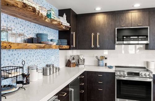 Avalon Condo | Luxury 4BR Villa: Vaulted Ceilings + Ocean Views + 6-seat golf cart.