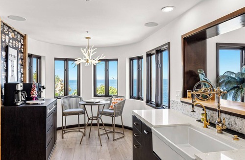 Avalon Condo | Luxury 4BR Villa: Vaulted Ceilings + Ocean Views + 6-seat golf cart.
