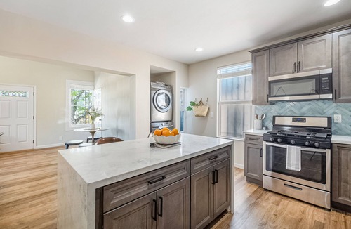 East Village House | Modern downtown home with fast WiFi, central AC, washer/dryer - near the ocean