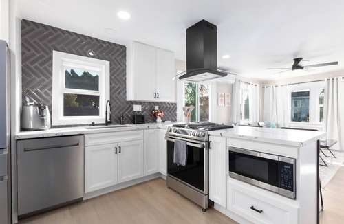 Corridor House | Modern Home Near Downtown with Firepit and BBQ