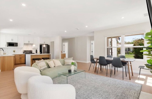 The Plaza House | *New* modern pool home + 5 mi to beach + sleeps 14