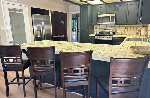 Oak Park House | Private oasis in backyard, beach entry solar heated pool, jacuzzi & water slide