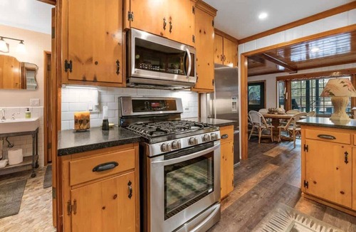 Boulder Bay House | Waterfront. Gameroom, Dock in water. Spa. Firepit.