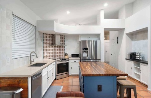 Fox Crossing Villa | Waterfront Villa with Pool Hot Tub Lounge area