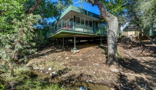 Modern cabin hidden among the trees- Unwind and relax on the porch creek-side.