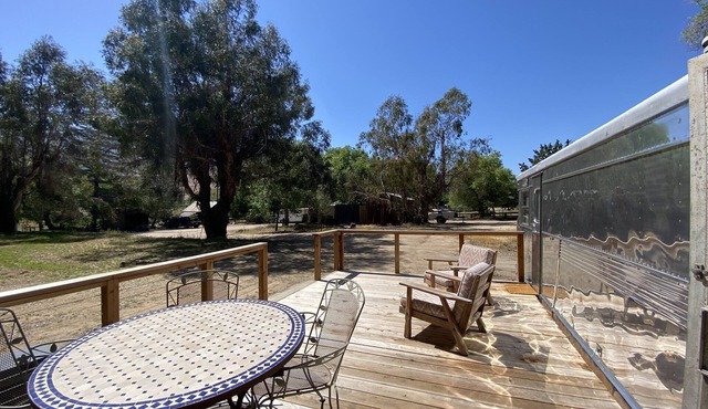 Vintage wood paneled travel trailer on Kernville Ranch: horses, river, hot tub