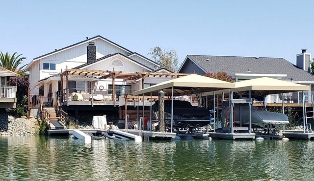 Waterfront Home with large boat dock & boat rental and other water toys