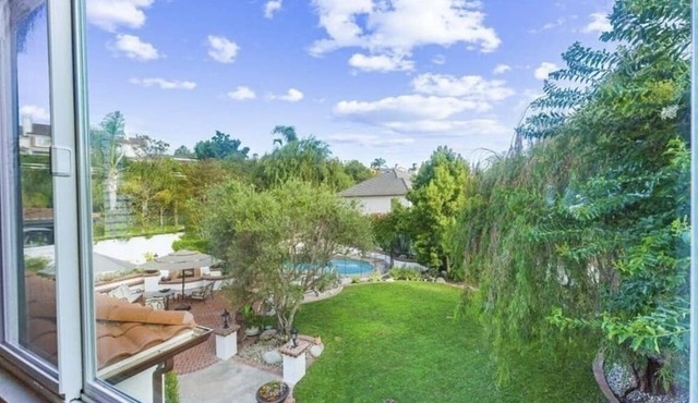 Immaculate Spanish Hacienda Style Estate on large private lot!